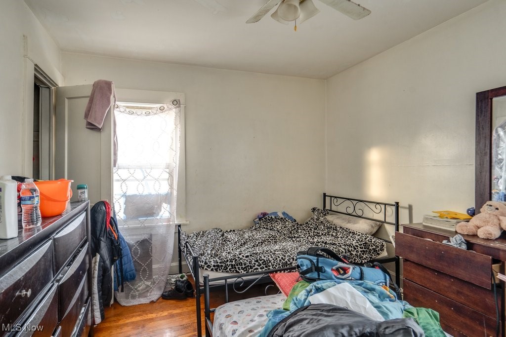 825 Rudyard Road Cleveland, OH 44110 - Photo 17 of 21 Bedroom with hardwood / wood-style flooring and ceiling fan