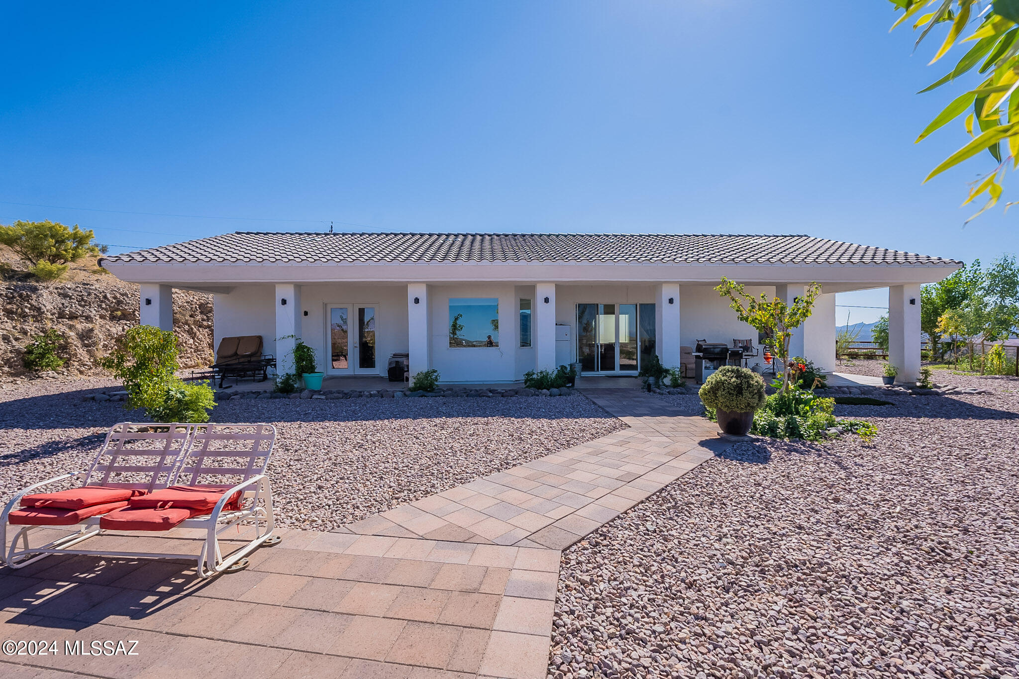 176 Avenida Ostion Rio Rico, AZ 85648 - Photo 41 of 48 a front view of a house with potted plants