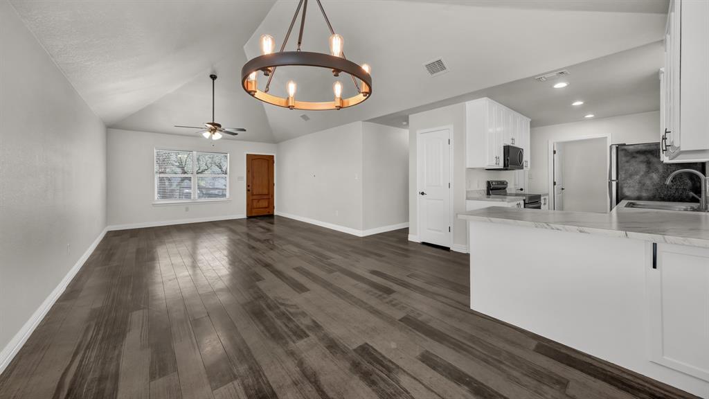 1830 Hitching Post Road Granbury, TX 76049 - Photo 11 of 34 a view of a kitchen from the hallway