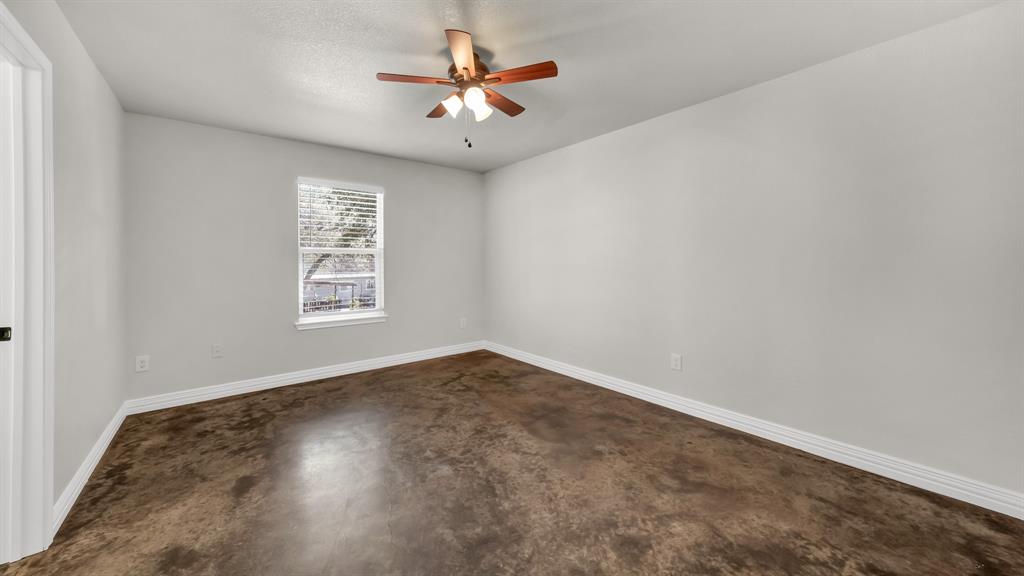 1830 Hitching Post Road Granbury, TX 76049 - Photo 21 of 34 an empty room with a window and a fan