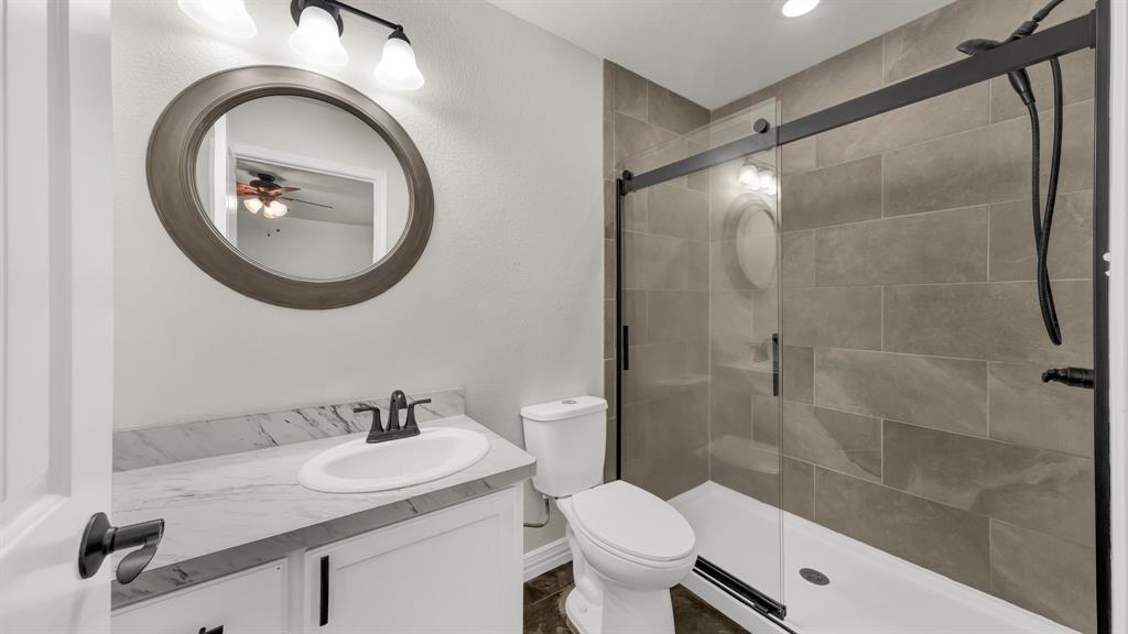 1830 Hitching Post Road Granbury, TX 76049 - Photo 23 of 34 a bathroom with a sink and a mirror