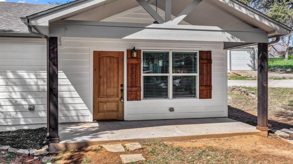 1830 Hitching Post Road Granbury, TX 76049 - Photo 3 of 34 a view of entrance gate of a house