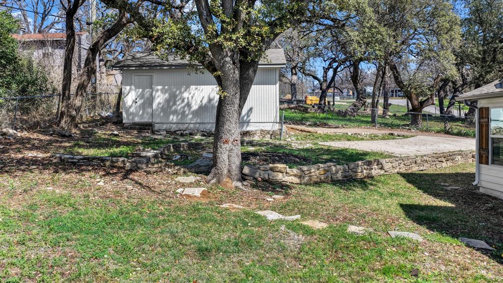 1830 Hitching Post Road Granbury, TX 76049 - Photo 33 of 34 a view of a yard with a tree