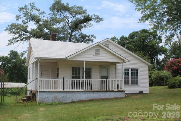 front view of a house with a garden