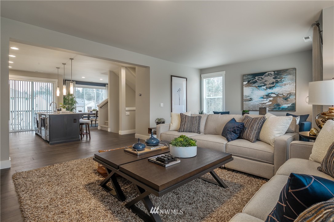 23205 89th Avenue West, Unit 8 Edmonds, WA 98026 - Photo 17 of 37 a living room with furniture a rug and a table