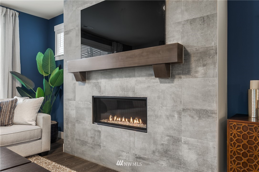 23205 89th Avenue West, Unit 8 Edmonds, WA 98026 - Photo 23 of 37 a living room with furniture and a fireplace
