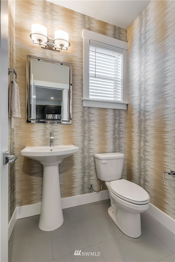 23205 89th Avenue West, Unit 8 Edmonds, WA 98026 - Photo 24 of 37 a bathroom with a toilet sink and mirror