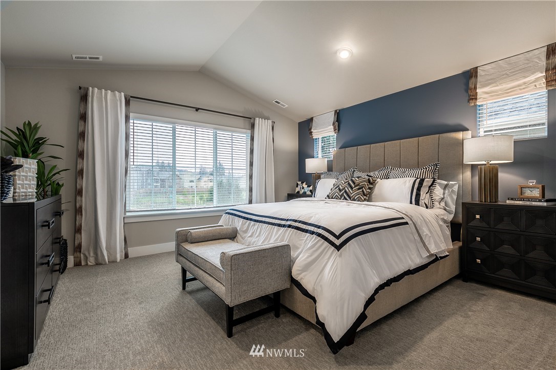 23205 89th Avenue West, Unit 8 Edmonds, WA 98026 - Photo 25 of 37 a bed room with a bed and a couch