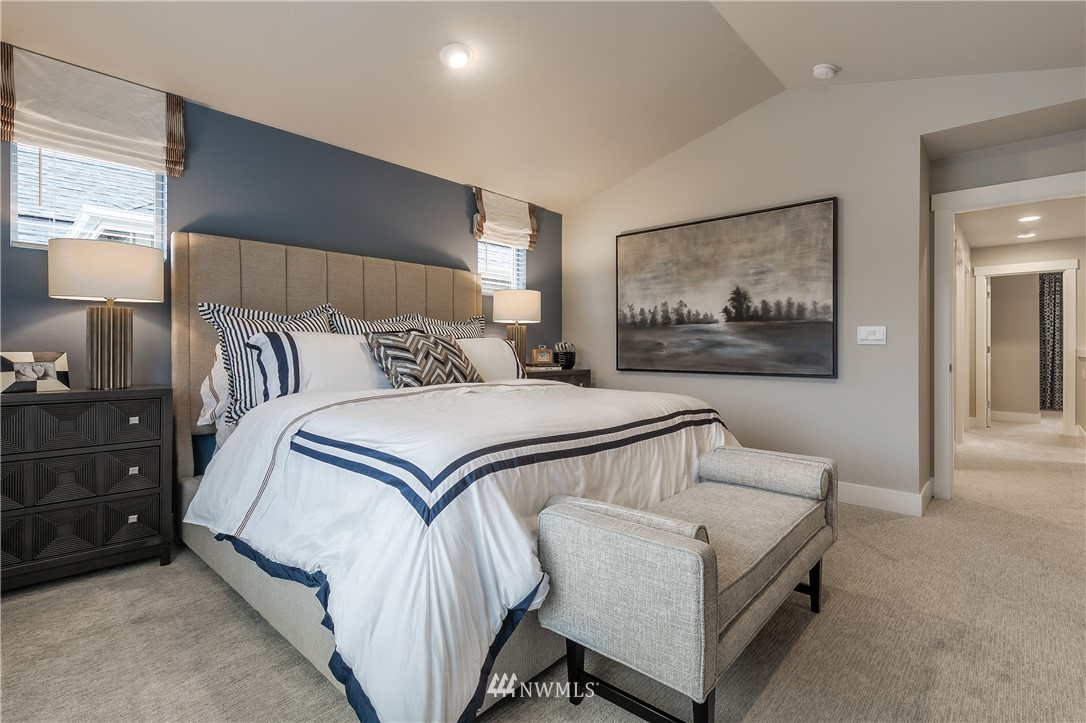 23205 89th Avenue West, Unit 8 Edmonds, WA 98026 - Photo 26 of 37 a bedroom with a bed and lamp