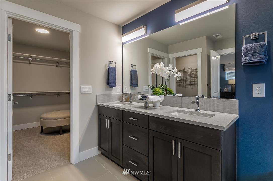 23205 89th Avenue West, Unit 8 Edmonds, WA 98026 - Photo 28 of 37 a bathroom with a double vanity sink and mirror