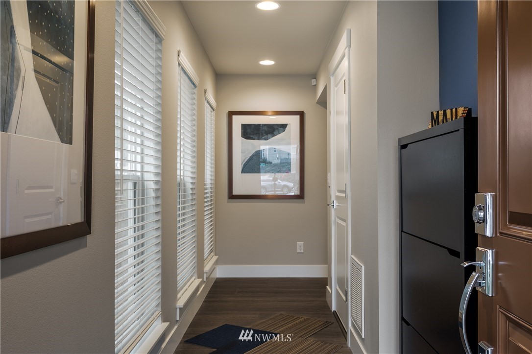 23205 89th Avenue West, Unit 8 Edmonds, WA 98026 - Photo 3 of 37 a view of hallway with stairs and wooden floor