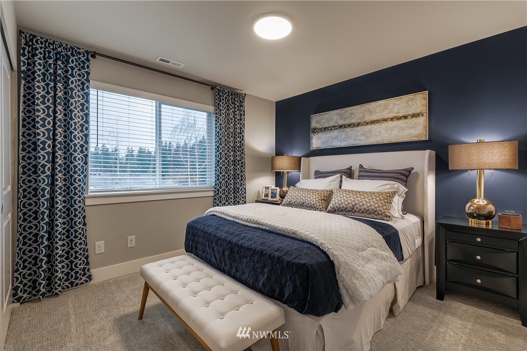 23205 89th Avenue West, Unit 8 Edmonds, WA 98026 - Photo 33 of 37 a bedroom with a bed and a window