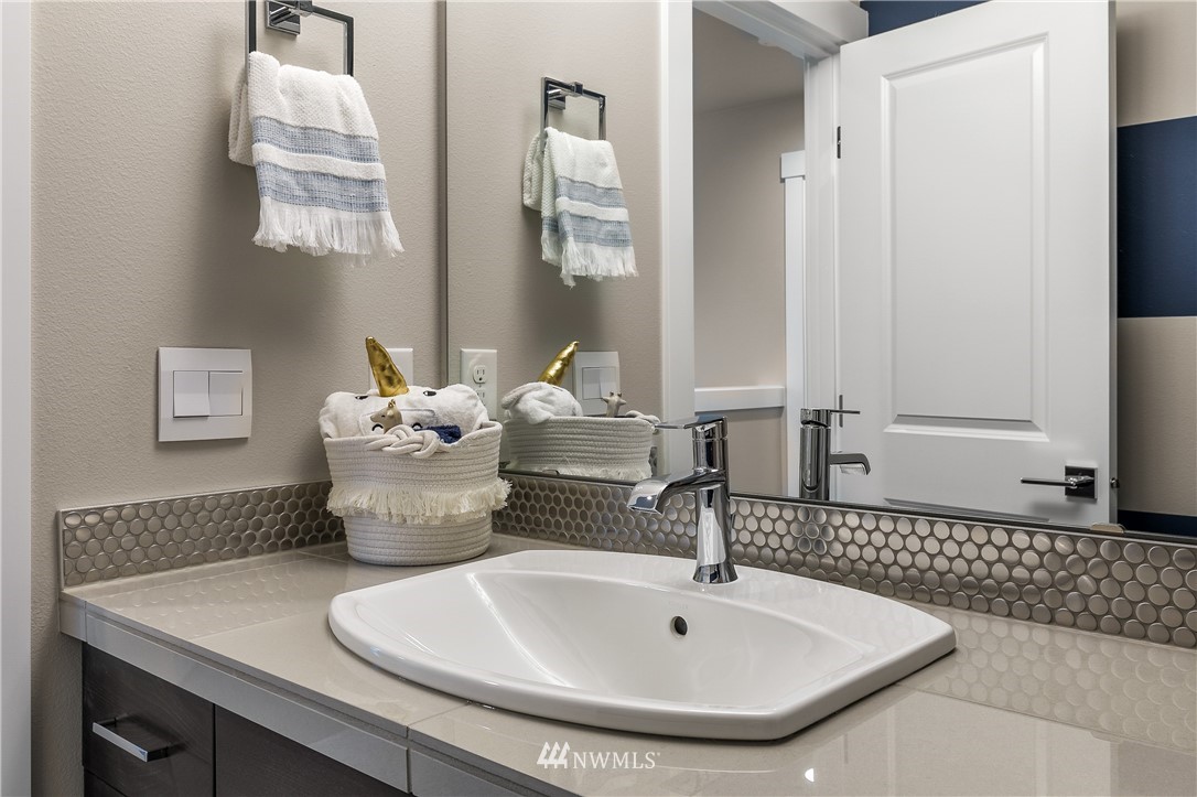 23205 89th Avenue West, Unit 8 Edmonds, WA 98026 - Photo 37 of 37 a bathroom with a sink and a mirror