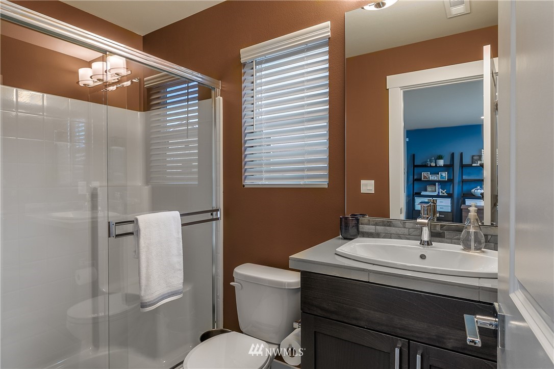23205 89th Avenue West, Unit 8 Edmonds, WA 98026 - Photo 7 of 37 a bathroom with a sink a toilet and shower