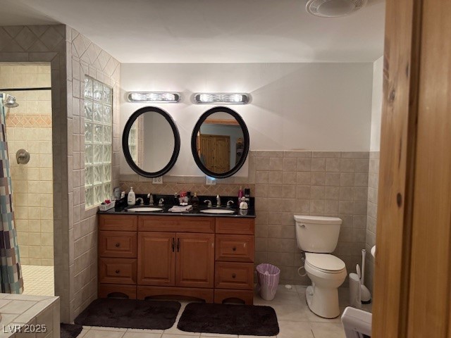 1560 Fort Churchill Road Pahrump, NV 89060 - Photo 13 of 24 Bathroom with tile walls, double vanity, light til