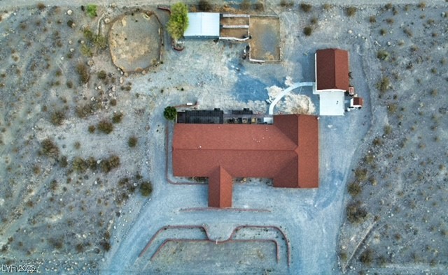 1560 Fort Churchill Road Pahrump, NV 89060 - Photo 20 of 24 Drone / aerial view of a desert landscape