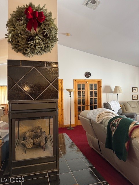 1560 Fort Churchill Road Pahrump, NV 89060 - Photo 10 of 24 Living area with lofted ceiling, a fireplace, and