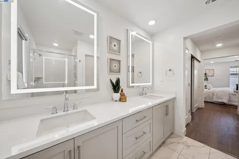 a bathroom with a glass shower door