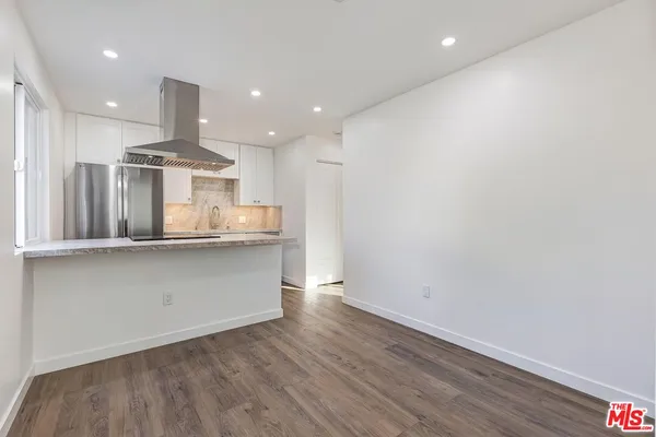 a view of kitchen with wooden floor