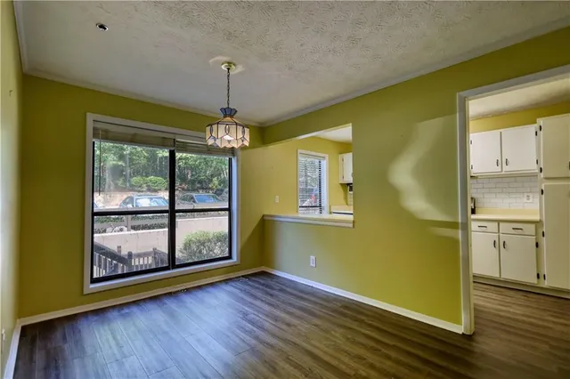 a living room with furniture fireplace and a table