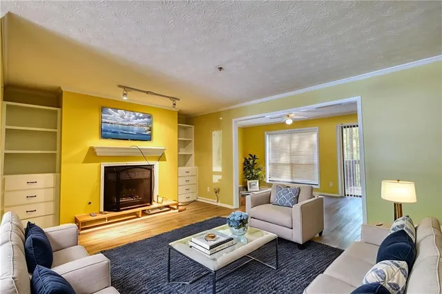 wooden floor fireplace and natural light in room