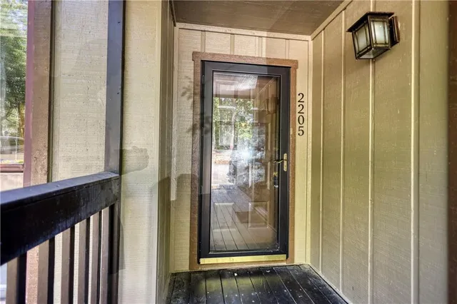 a kitchen with stainless steel appliances white cabinets and a stove a refrigerator a sink