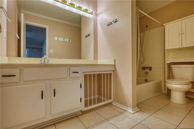an empty room with wooden floor and closet