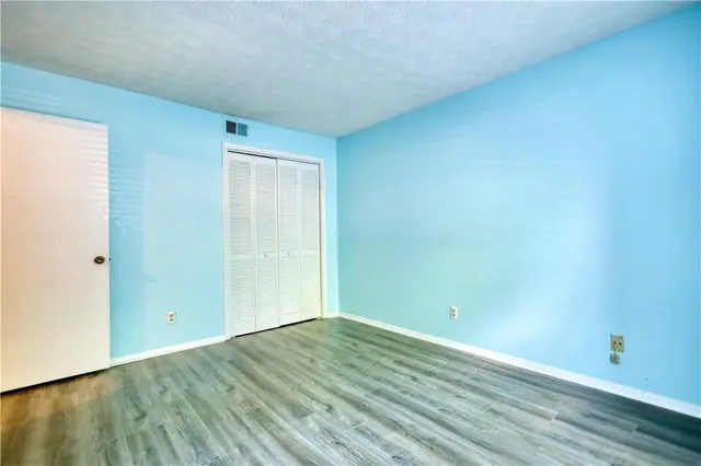 a view of swimming pool with sitting area and garden