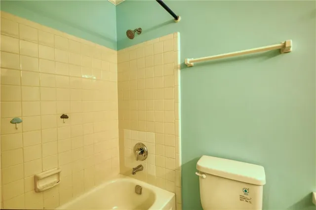 a view of a swimming pool with chairs