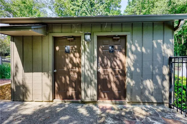 a front view of a building with parking area