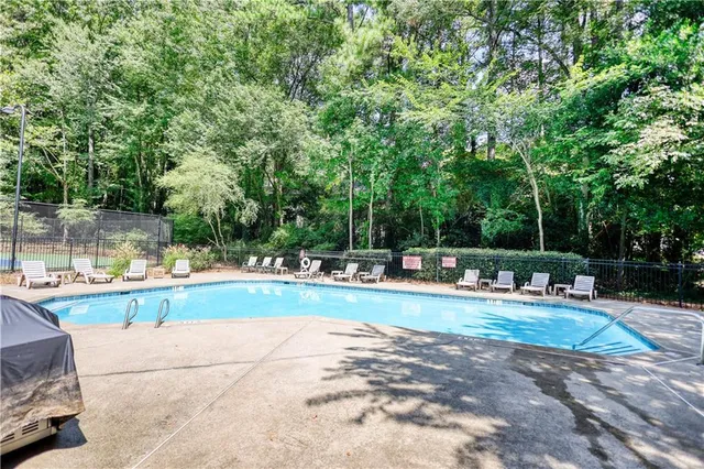 an aerial view of a house with a yard and trees