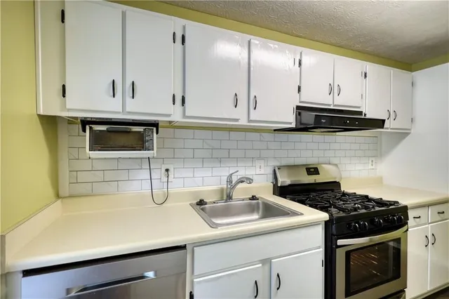 a bathroom with a shower and a sink