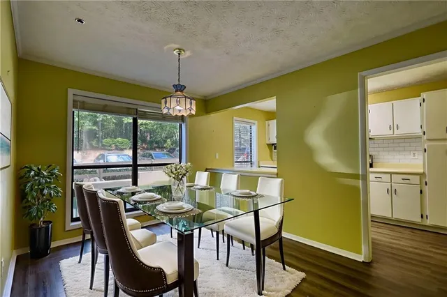 a window in an empty room with wooden floor