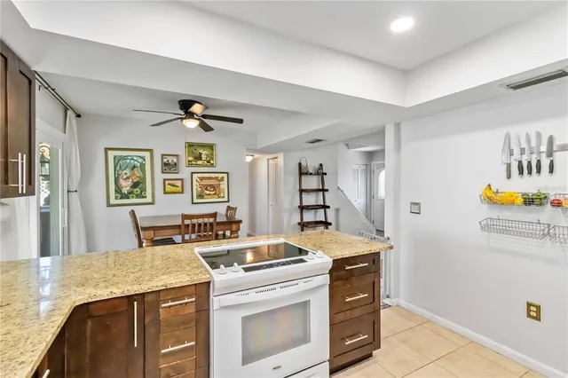 a kitchen with stainless steel appliances granite countertop a stove and a refrigerator