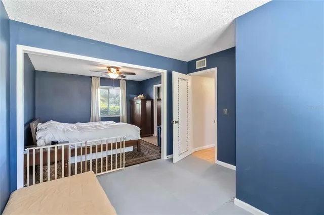 a bedroom with bed and a window