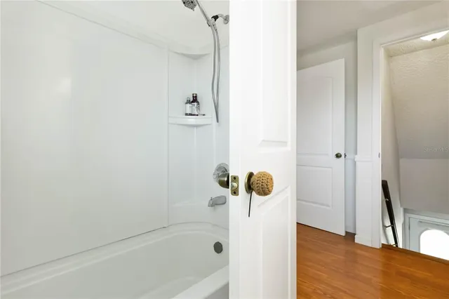 a bathroom with a bathtub and a shower