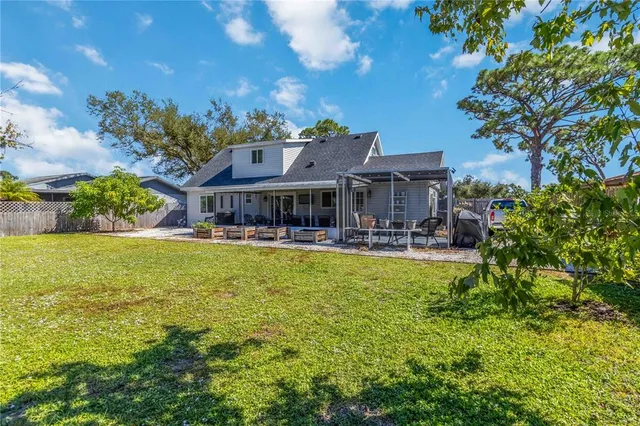 a front view of house with yard and outdoor seating