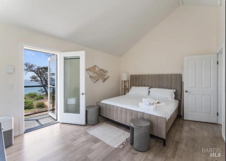 35800 Highway 1 Gualala, CA 95445 - Photo 18 of 42 a spacious bedroom with a bed and a window