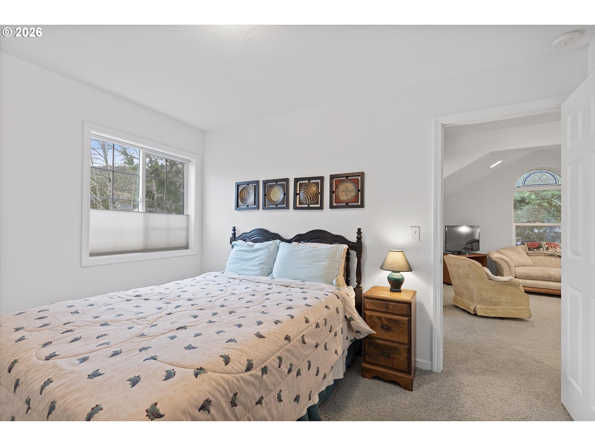 49800 Proposal Rock Loop Neskowin, OR 97149 - Photo 22 of 29 a bedroom with a bed a couch and a window