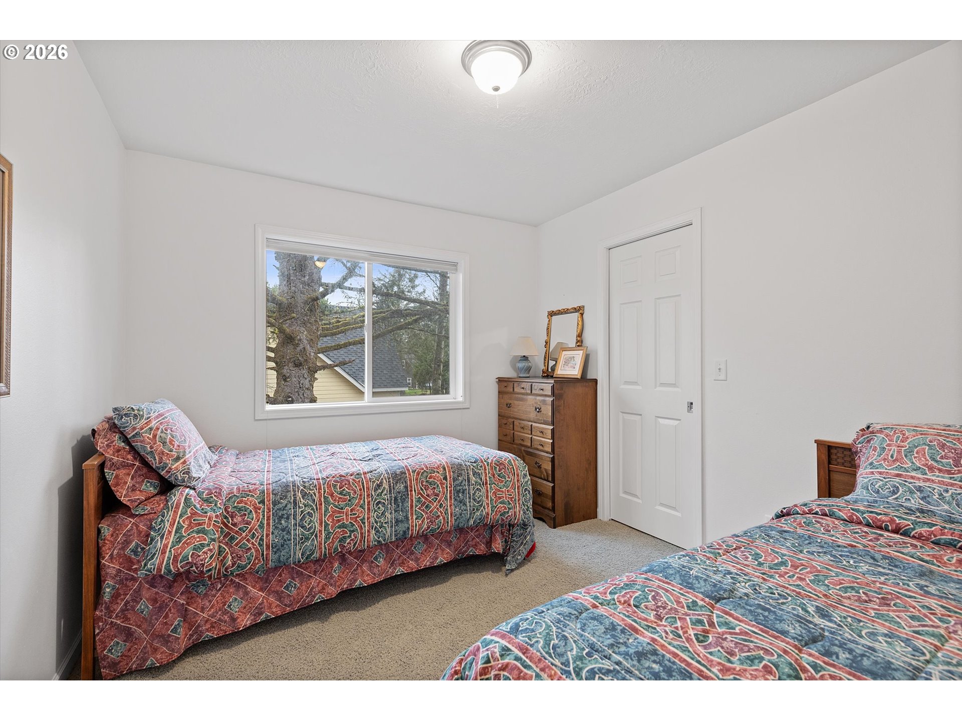 49800 Proposal Rock Loop Neskowin, OR 97149 - Photo 23 of 29 a bedroom with a bed and a window