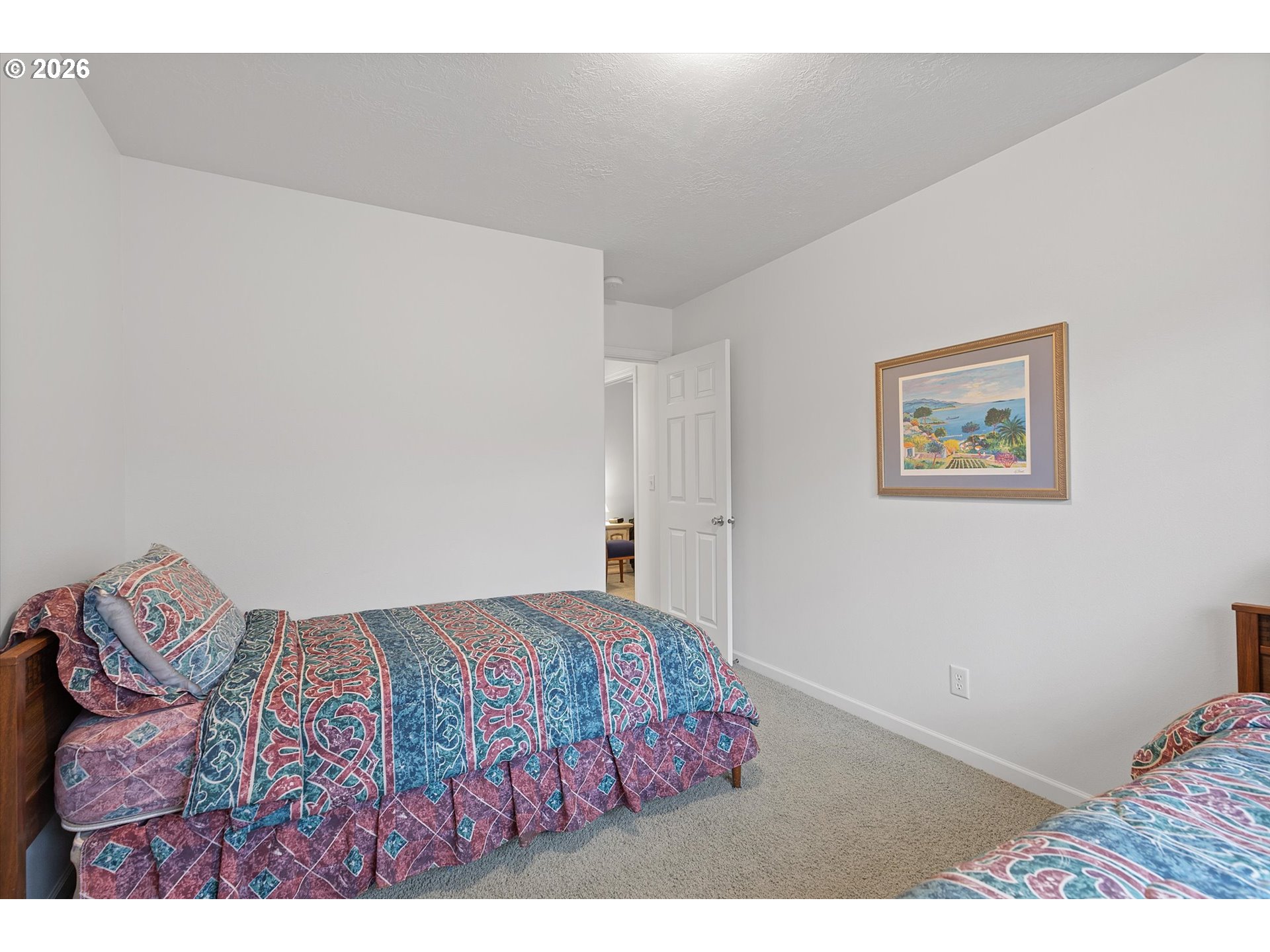49800 Proposal Rock Loop Neskowin, OR 97149 - Photo 24 of 29 a bedroom with a bed and a lamp