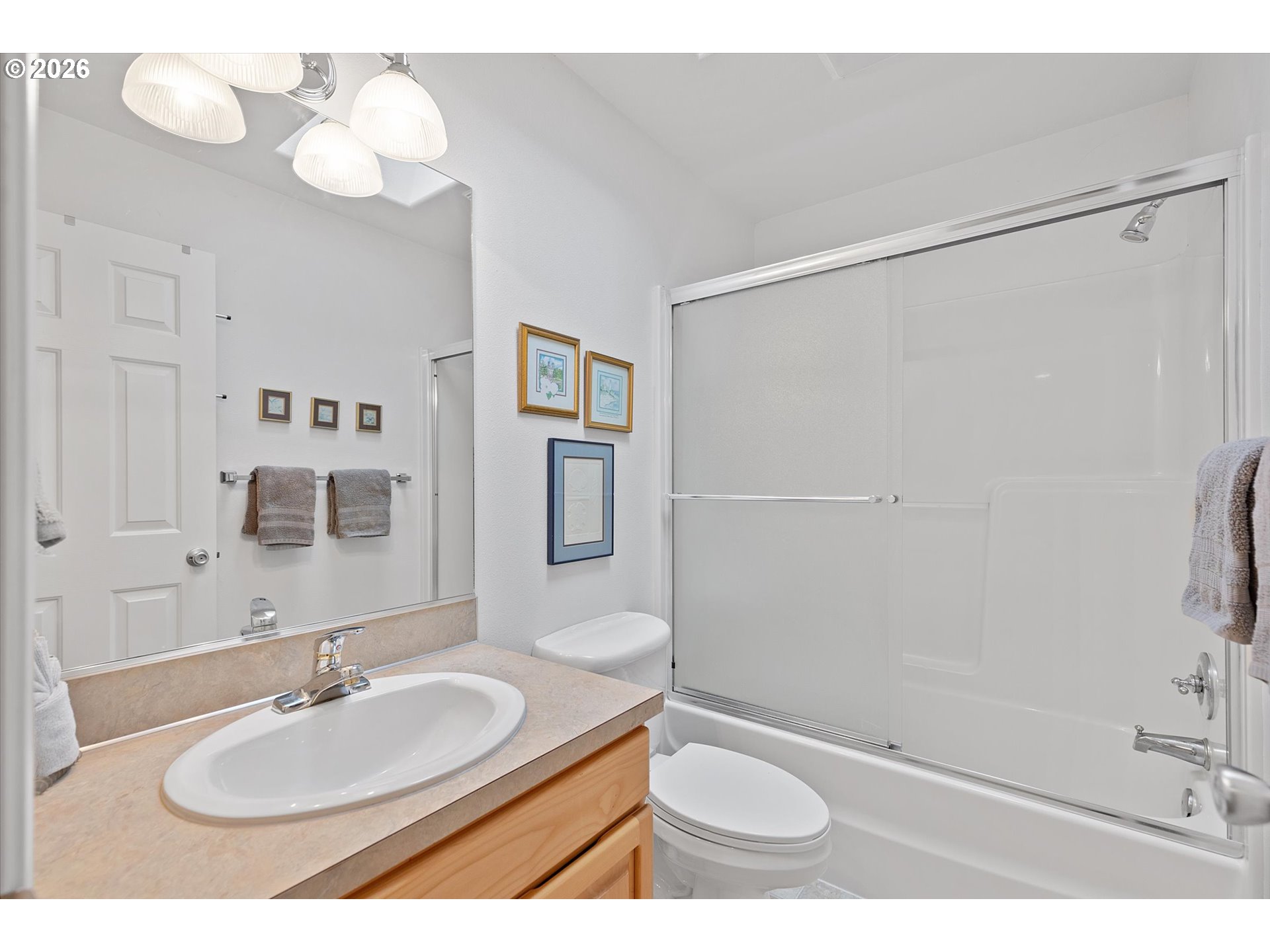 49800 Proposal Rock Loop Neskowin, OR 97149 - Photo 25 of 29 a bathroom with a sink a toilet and a mirror