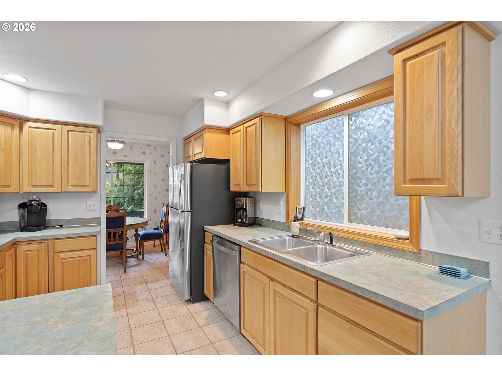 49800 Proposal Rock Loop Neskowin, OR 97149 - Photo 3 of 29 a kitchen with a sink a counter top space and stainless steel appliances