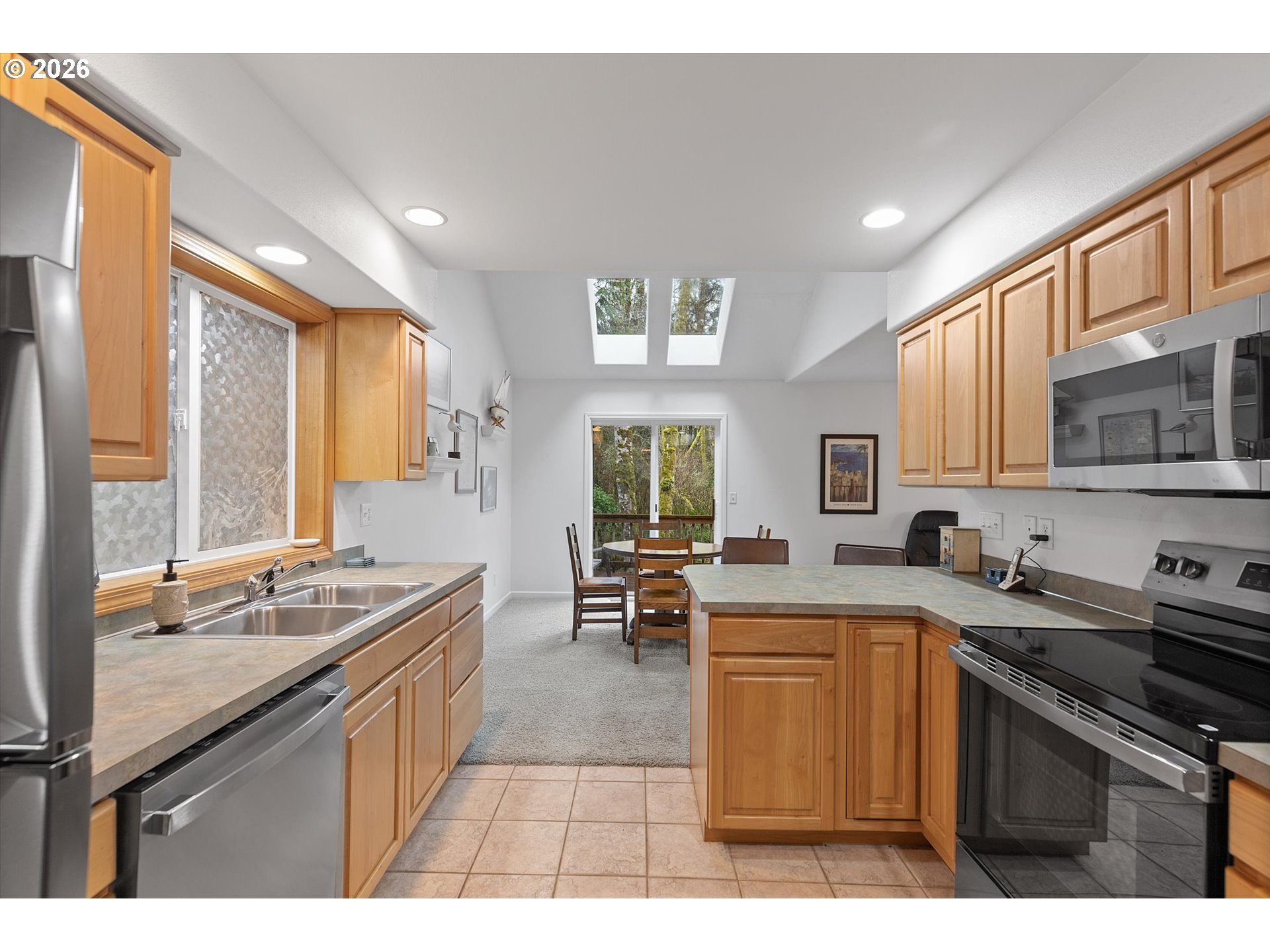 49800 Proposal Rock Loop Neskowin, OR 97149 - Photo 5 of 29 a kitchen with stainless steel appliances granite countertop a sink stove and cabinets
