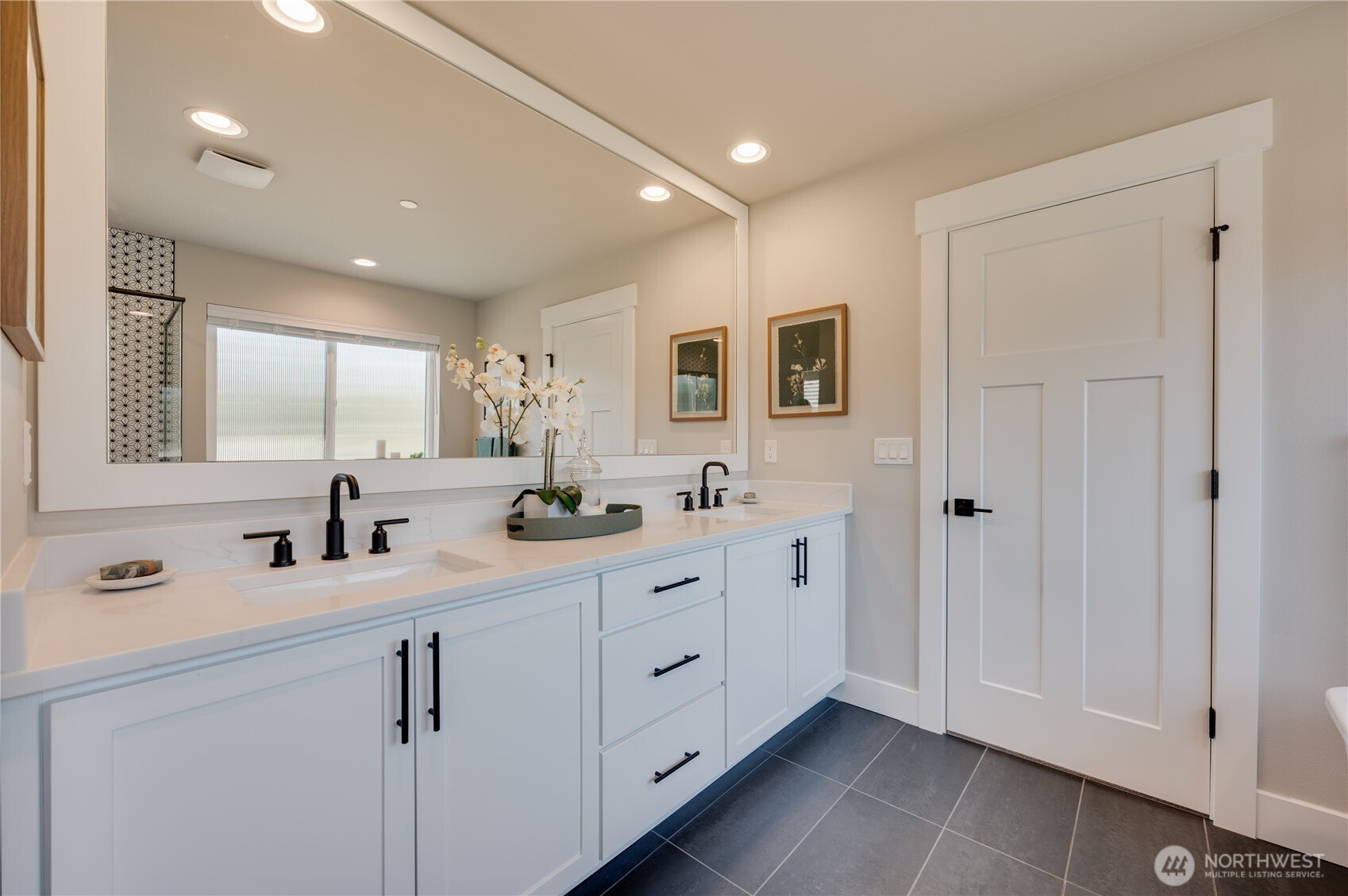 14 Meridian Avenue Southeast, Unit CR 10 Bothell, WA 98012 - Photo 27 of 37 a bathroom with a double vanity sink mirror and
