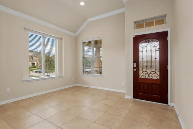 a view of a kitchen with a sink and a refrigerator