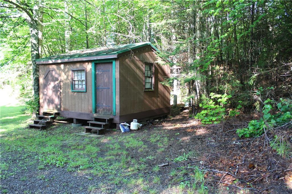 460 Birches Beach Road Oquossoc, ME 04964 - Photo 5 of 35 storage/wood shed