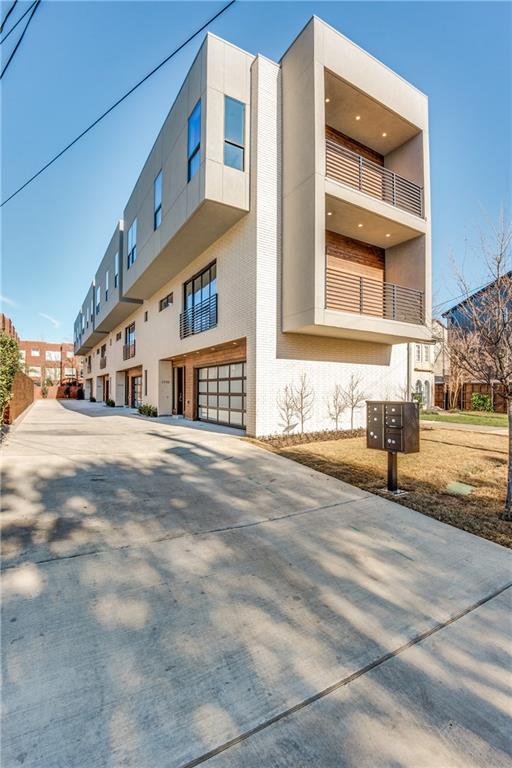a front view of residential houses with street