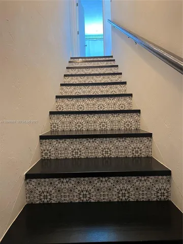 a kitchen with sink and cabinets