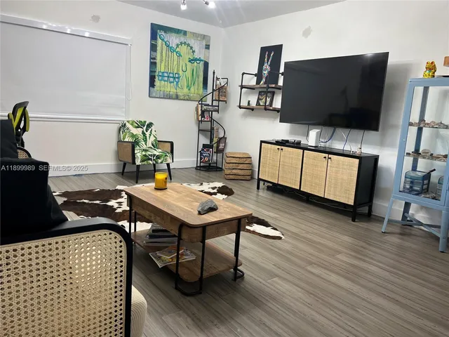 a bedroom with a bed and furniture